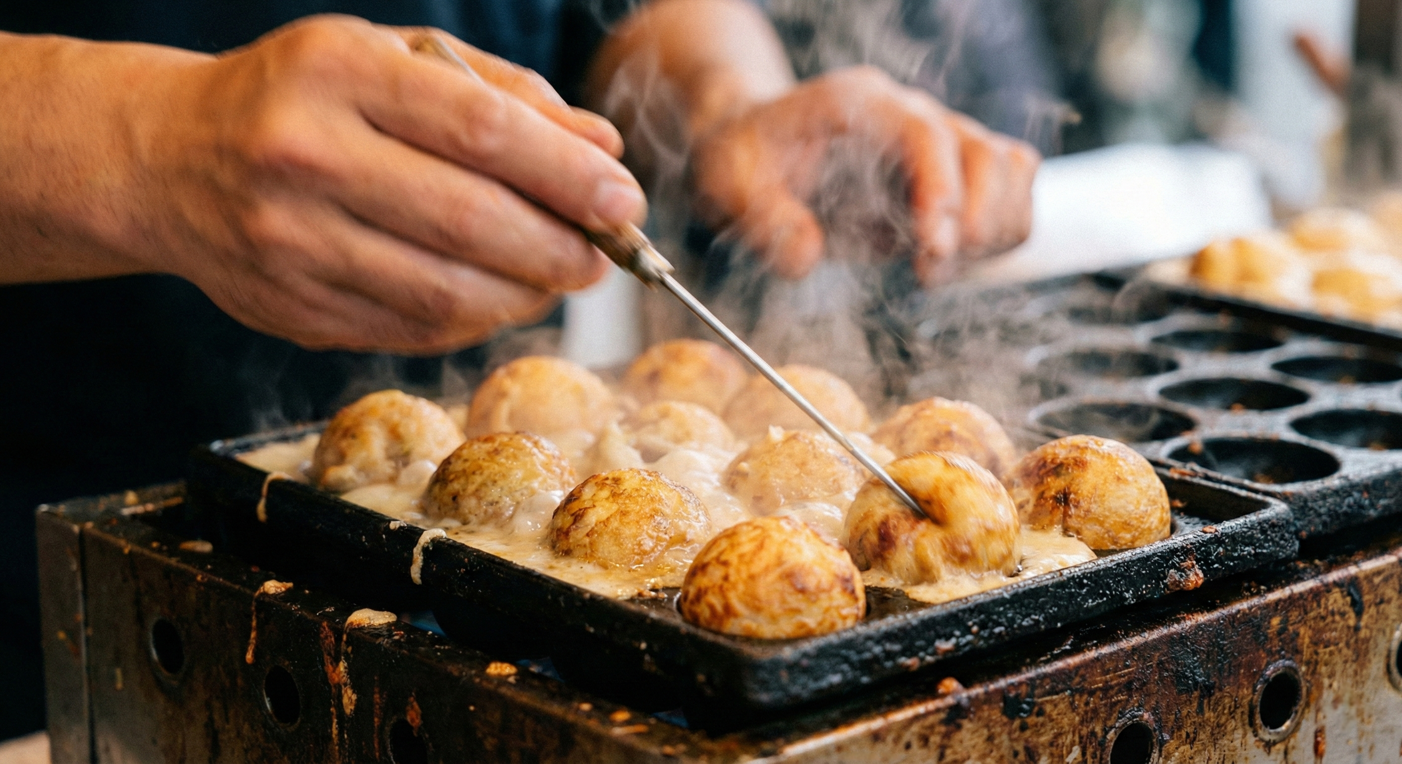 A close-up shot of a street vendor expertly flipping golden takoyaki balls in a sizzling iron pan, with steam rising and a bustling, colorful Dotonbori background.